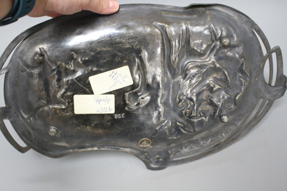 A WMF pewter tray, decorated with two maidens, 23cm, and another tray decorated with Diana hunting a stag, 41cm